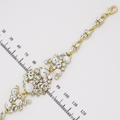 Браслет № 336 ажурный с белыми стразами на основе под золото.